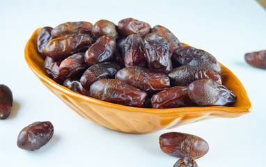 sweet algerian arabic dates fruits on a plate