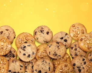 Cookies with sesame seeds and chocolate on white background