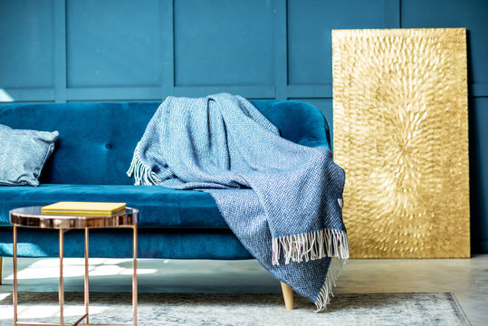 Interior View Of The Living Room With Comfortable Couch And Blue Walls