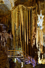 Amazing geological forms in Tien Son Cave near Phong Nha, Vietnam. Limestone cave full of stalactites and stalagmites.