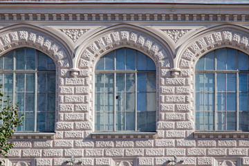  windows and details on an exterior of the building.