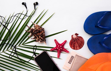 flat layout, tropical background, travel and beach holiday concept with smartphone on white...