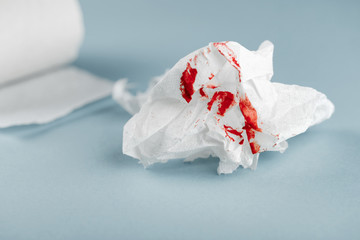 Hemorrhoids, treatment health problems. Toilet paper with the blood drops