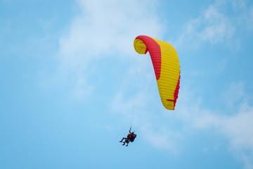 Tandem paragliders flying in the sky