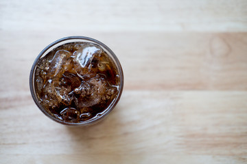Refreshing black soda soft drinks with ice in a clear glass