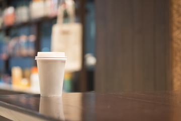 Paper cup of coffee take away at cafe shop