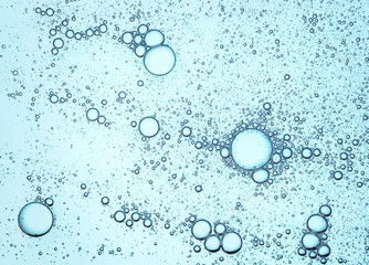 Cream gel greenish-blue turquoise transparent cosmetic sample texture with bubbles isolated on...
