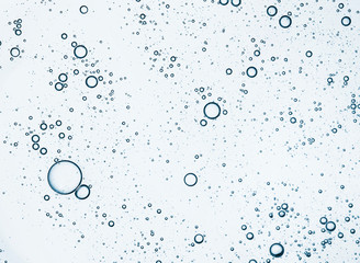 Cream gel greenish-blue turquoise transparent cosmetic sample texture with bubbles isolated on...