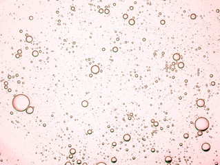 Cream gel yellow orange transparent cosmetic sample texture with bubbles isolated on white background