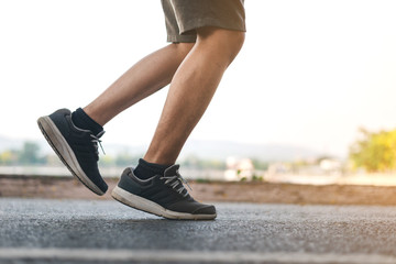 Man running on the park with Close up shoes 