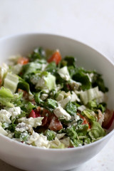 Various vegetables and feta cheese salad. Selective focus. 