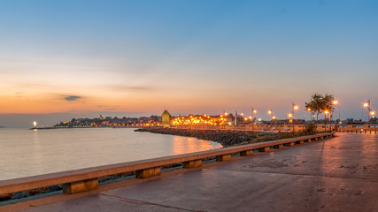 Fototapeta premium The Windmill on the street leading to Nessebar ancient city at sunrise on the Bulgarian Black Sea Coast. Nesebar or Nesebr is a UNESCO World Heritage Site. Isthmus leading to Nessebar