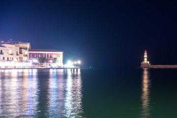Naklejka premium Greece, Chania, August 2018: illuminated venetian habour of Chania at night, Crete, Greece