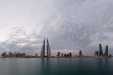 A beautiful view of Bahrain skyline during sunrise with BFH and WTC buildings