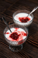 Raspberry yougurt on wooden