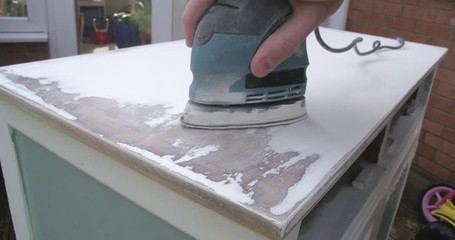 An old cabinet getting an upcycle with sanding back to wood