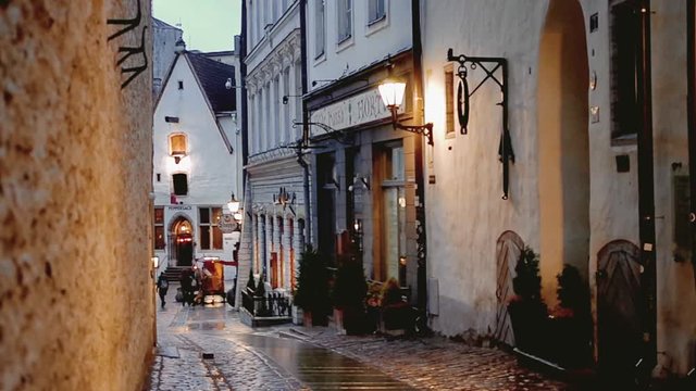 A cosy atmosphere on a street of medieval Old Town of Tallinn.
