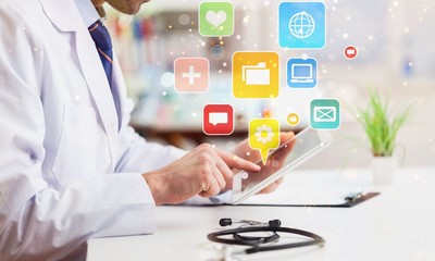 Close-up Doctor at hospital working with tablet pc