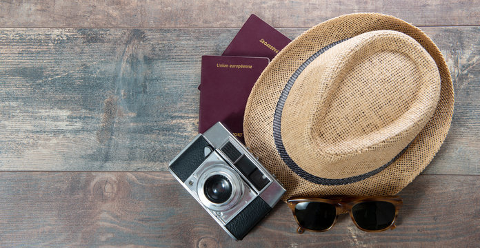 passports, summer hat and camera ready for holidays