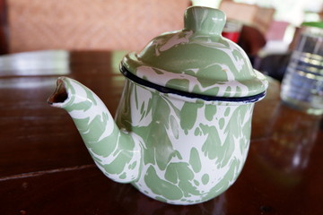 traditional teapots from Indonesia made from zinc and patterned batik