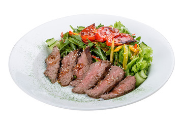 Salad with roast beef and sun-dried tomatoes on white background