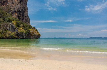 Rocky mountain in located at the beautiful sea. Summer beach  sand Ao Nang, Krabi, Thailand