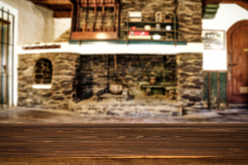 Desk of free space and fireplace in home interior. Wild west background. 