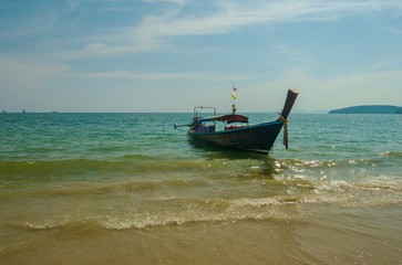 Thai traditional wooden long tail boat beach sand  Ao Nang, Krabi, Thailand