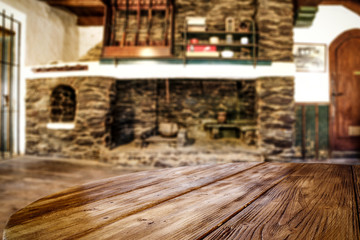 Desk of free space and fireplace in home interior. Wild west background. 