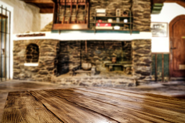 Desk of free space and fireplace in home interior. Wild west background. 