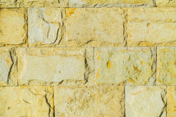 Stone wall pattern. Big concrete bricks outside.