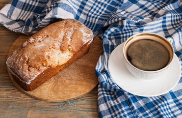 Coffee and cakes on a wooden table background