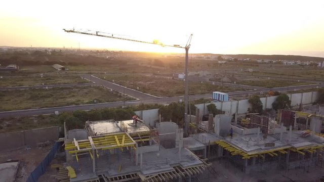 Aerial view on a construction site on a beautiful sunset