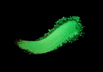 Eye shadow green mint crushed powder smudged isolated on black