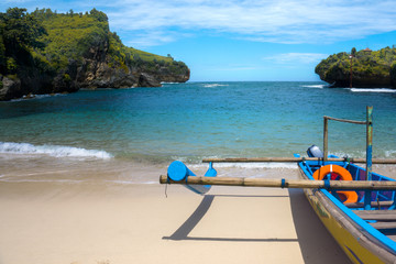 fishing boats that are pulling over on the beach