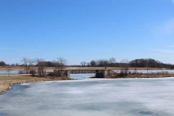 Foot bridge over a frozen lake at Independence Grove in Libertyville, Illinois