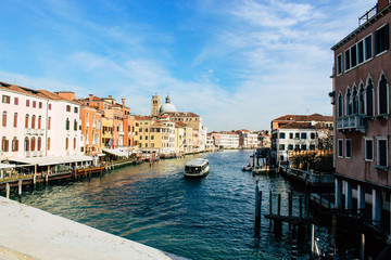 Grand Canal in Venice on a sunny day, Italy. Venice in the sunlight. Scenic panoramic view of Venice in winter. Cityscape and landscape of Venice. Romantic water trip.
