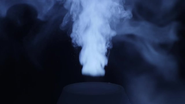 working a humidifier with a blue circular light
