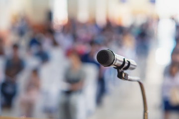Soft focus of head microphone on stage of Student Parents Meeting in summer school or event whit blurred background,Education meeting on stage concept and copy space,selective focus to head microphone - obrazy, fototapety, plakaty