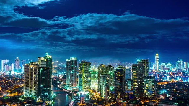 Time-lapse view on the illuminated skyline of Makati during sunset. 