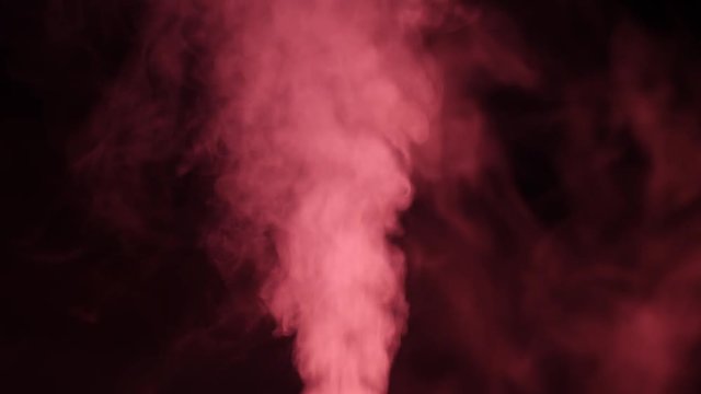 working a humidifier with a red circular light in the middle