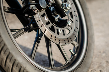 motorcycle wheel with brake disc closeup