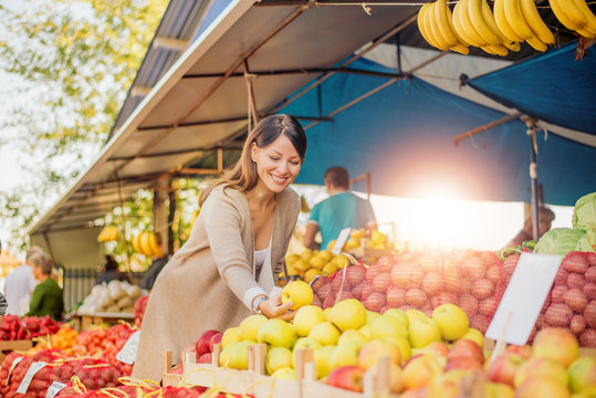 Beautiful Woman At Farmers Market.