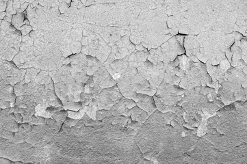 Old cracked paint on the concrete wall. Peeling paint on wall texture. Pattern of rustic blue grunge material
