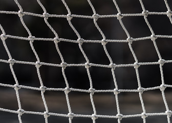 Interlacing white ropes. Football net close up. Old soccer gate.