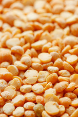 Background texture of pea porridge golden color in full-frame form. View from above. Close-up