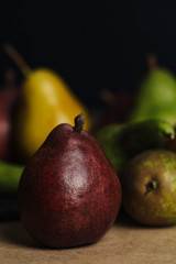 Fresh pears. Pears harvest. Fruit background. Fresh organic pears on old sacking. Nature concept. Dark mood. Close up.