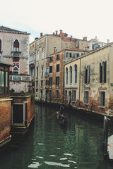 Bridge of Sighs people and tourists on gondola boat passing under the bridge in a sunny summer day in Venice, Italy