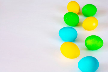 Easter eggs multicolored isolated on white background. Minimal easter concept. Happy easter card with copy space for text. Top view, flat.