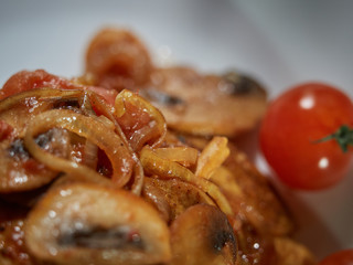 Fresh beef with fried mushrooms.